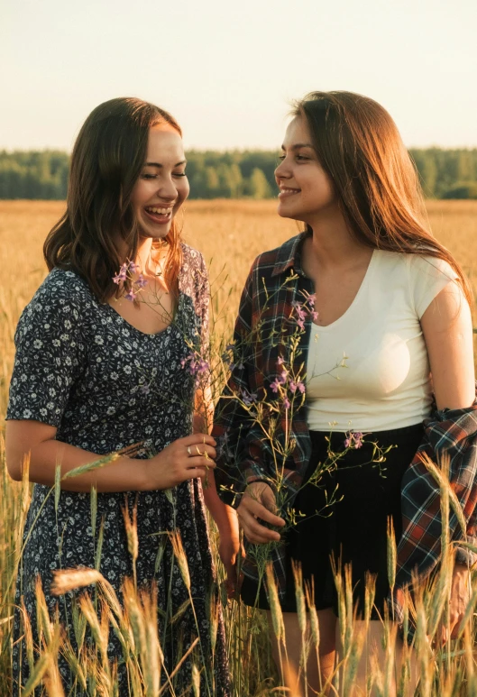 two women standing in a field of tall grass, trending on unsplash, russian girlfriend, avatar image, teen, smiling