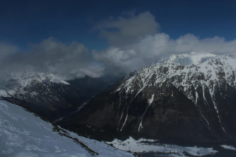 a man riding skis down a snow covered slope, by Peter Churcher, pexels contest winner, hurufiyya, panorama view of the sky, overlooking a valley, cinematic shot ar 9:16 -n 6 -g, panoramic view