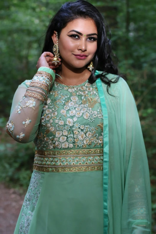 a woman in a green dress posing for a picture, desi, delicate embellishments, 2 5 6 x 2 5 6 pixels, glass and gold and jade