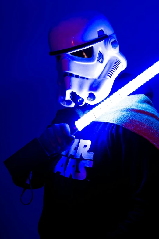 a man in a star wars costume holding a light saber, by Greg Staples, red and blue black light, closeup!!!!!, slide show, sports photo