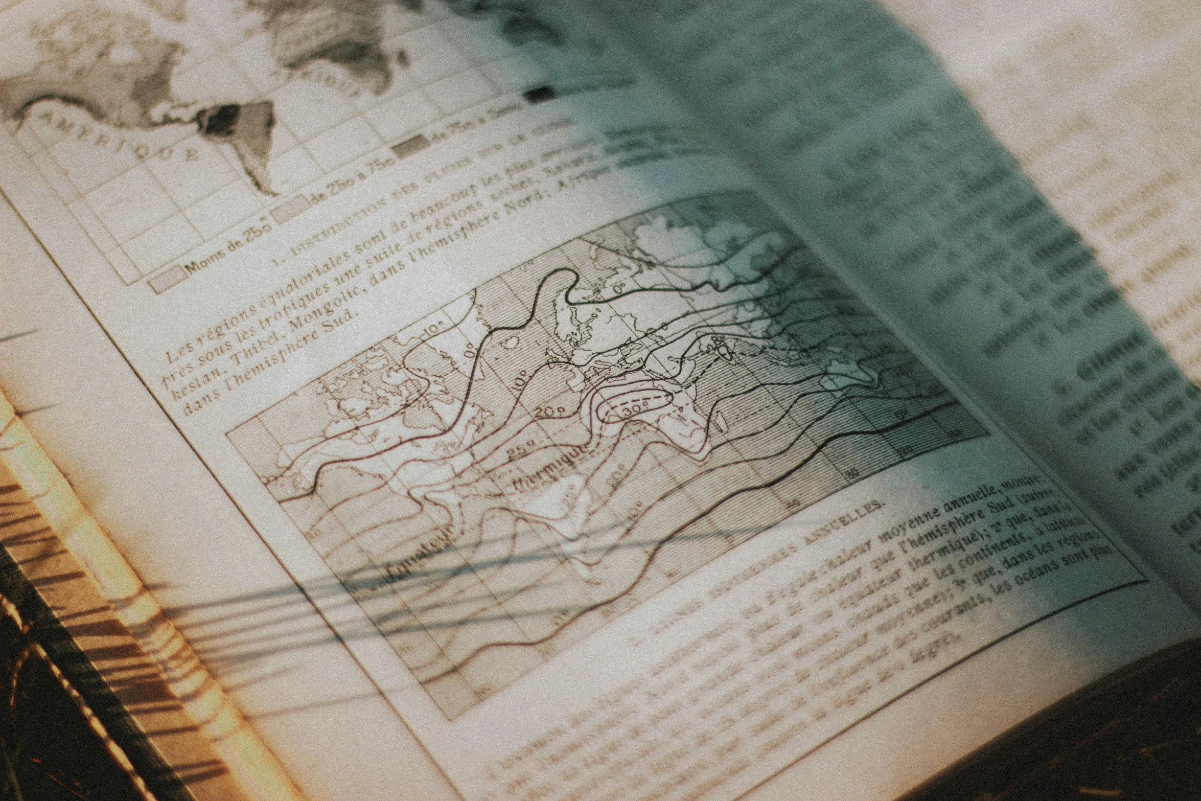 an open book sitting on top of a table, by Daniel Lieske, pexels contest winner, analytical art, map cartography, geomorphology, instagram story, graphic detail