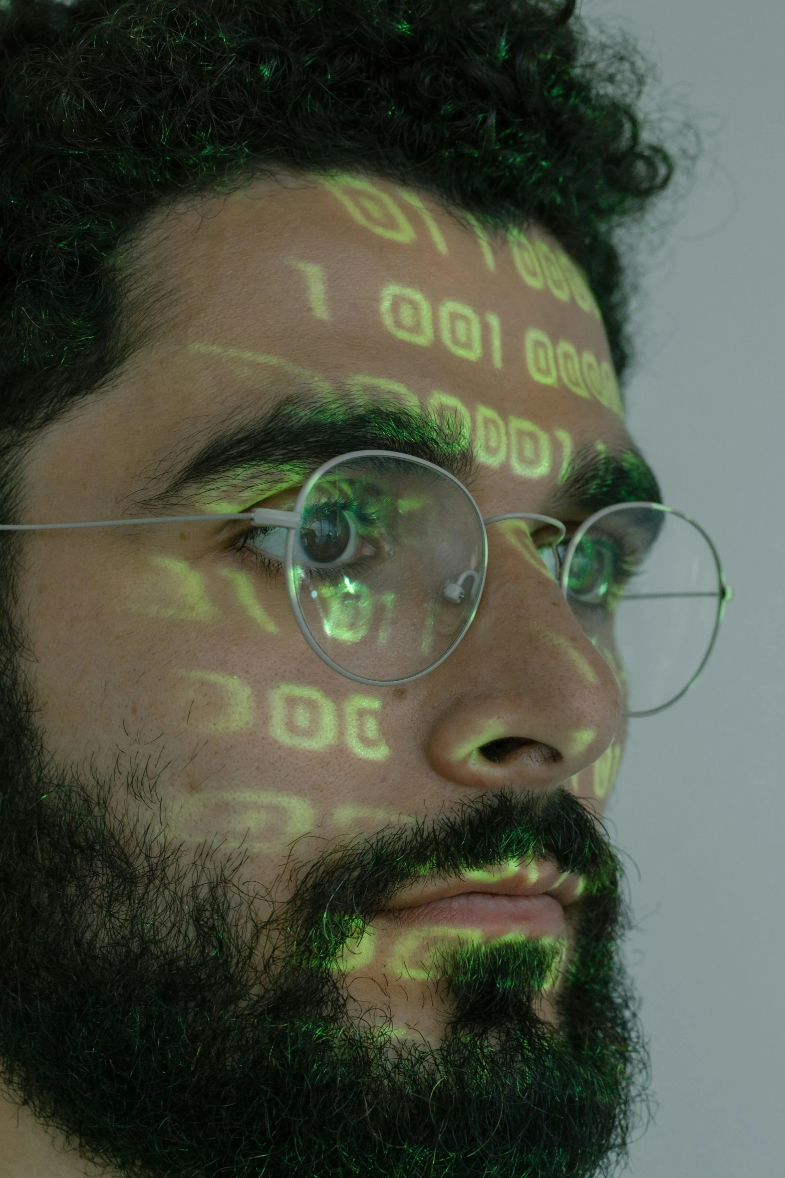 a close up of a man with a beard and glasses, holography, covered in circuitry, 2019 trending photo, sam nassour, riyahd cassiem