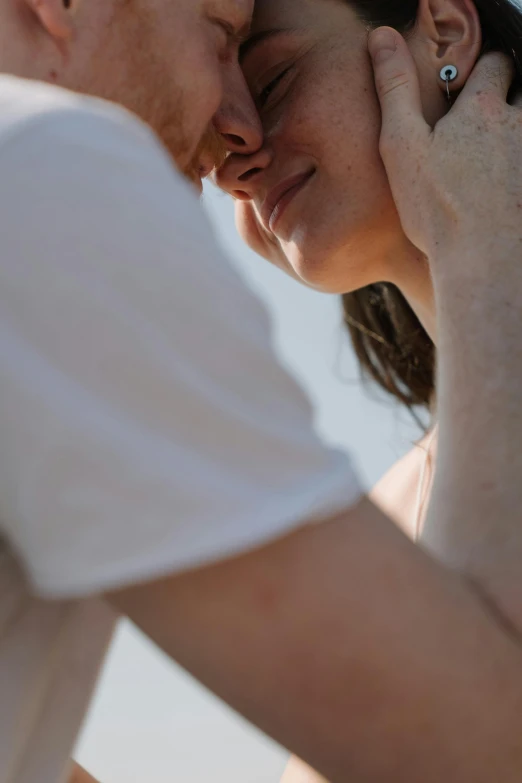 a man and a woman standing next to each other, by Jan Rustem, unsplash, renaissance, neck zoomed in from lips down, sunbathed skin, woman holding another woman, white freckles