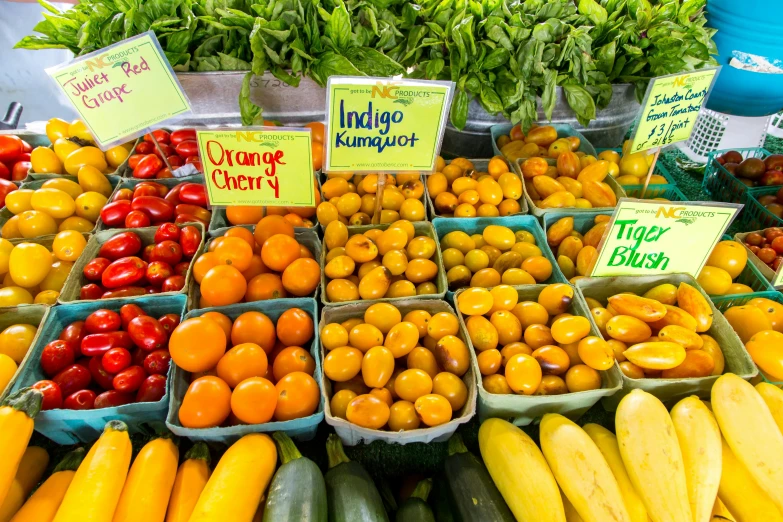 a variety of fruits and vegetables for sale at a farmer's market, by Meredith Dillman, pexels, yellow orange, colorful signs, thumbnail, meg kimura