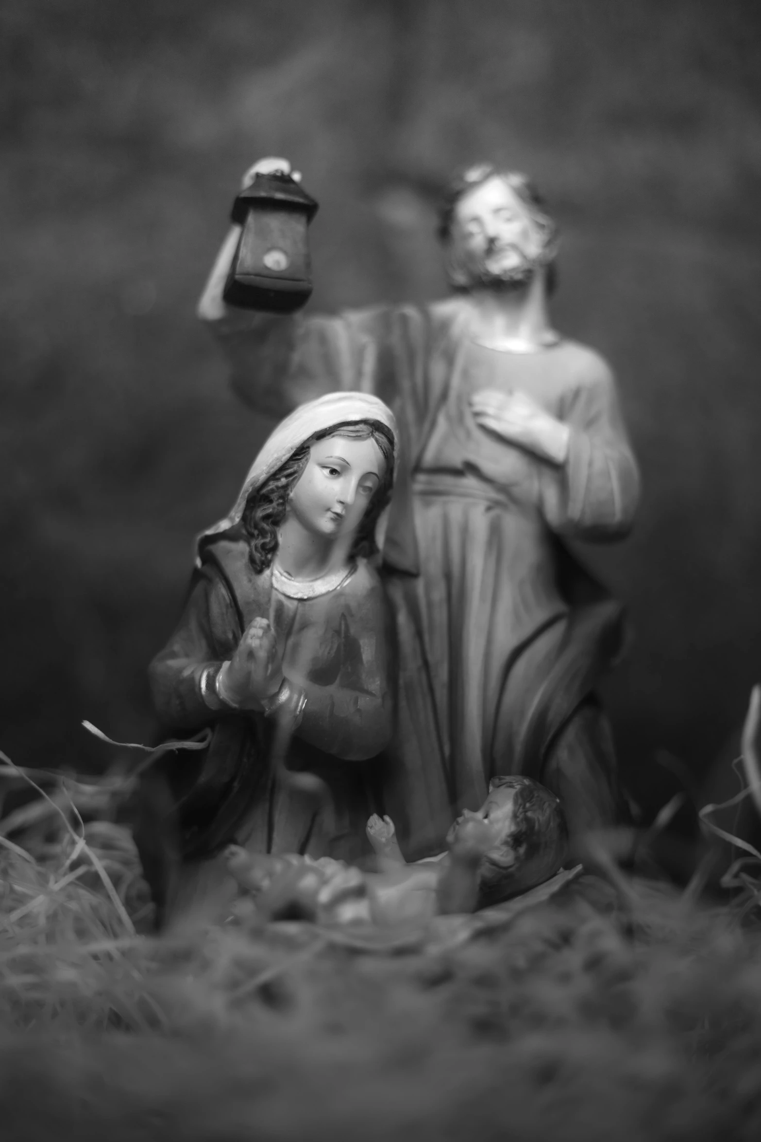 a black and white photo of a nativity scene, a statue, figuration libre, male and female, 120mm black and white photograph, catholic, illustration »