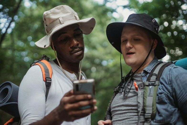 a couple of men standing next to each other, trending on pexels, renaissance, wearing a travel hat, phone photo, hiking clothes, avatar image