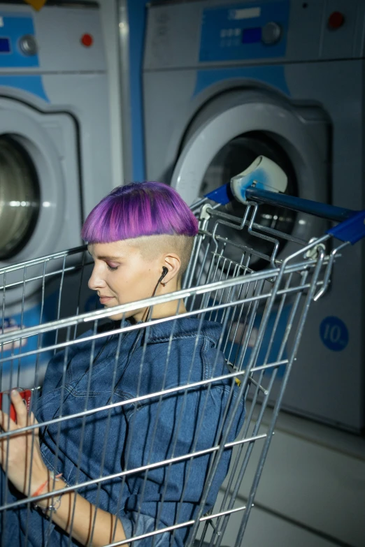 a woman with purple hair sitting in a shopping cart, an album cover, inspired by Elsa Bleda, trending on pexels, washing machine, people with mohawks, sergey krasovskiy, undercut