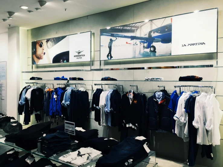 a clothing store filled with lots of clothes, a photo, by Tom Wänerstrand, lyco art, breitling, uniform off - white sky, profile image, giant screens