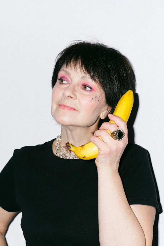 a woman holding a banana up to her ear, an album cover, by Ellen Gallagher, telephone, andrea savchenko, profile image, helen mcrory