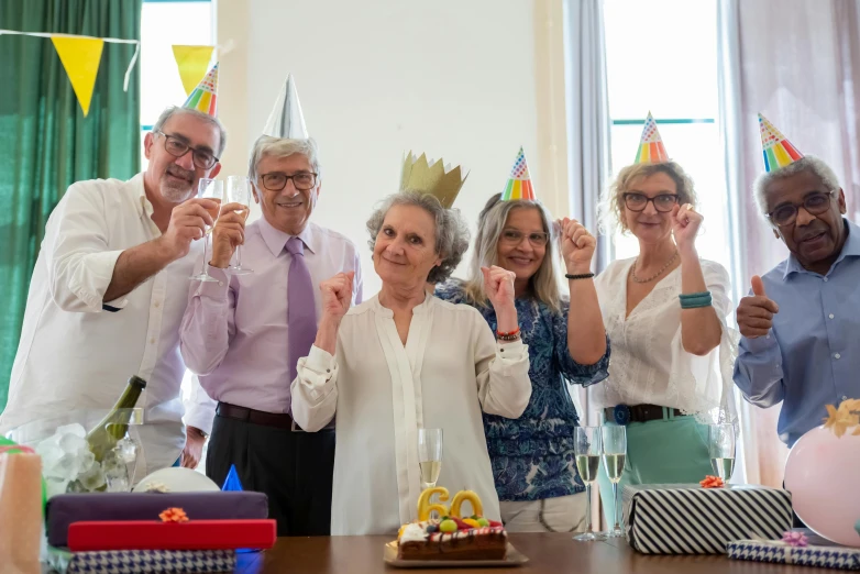 a group of older people celebrating a birthday, a portrait, pixabay contest winner, figuration libre, wearing a light grey crown, renzo piano, studio ghibili, in spain