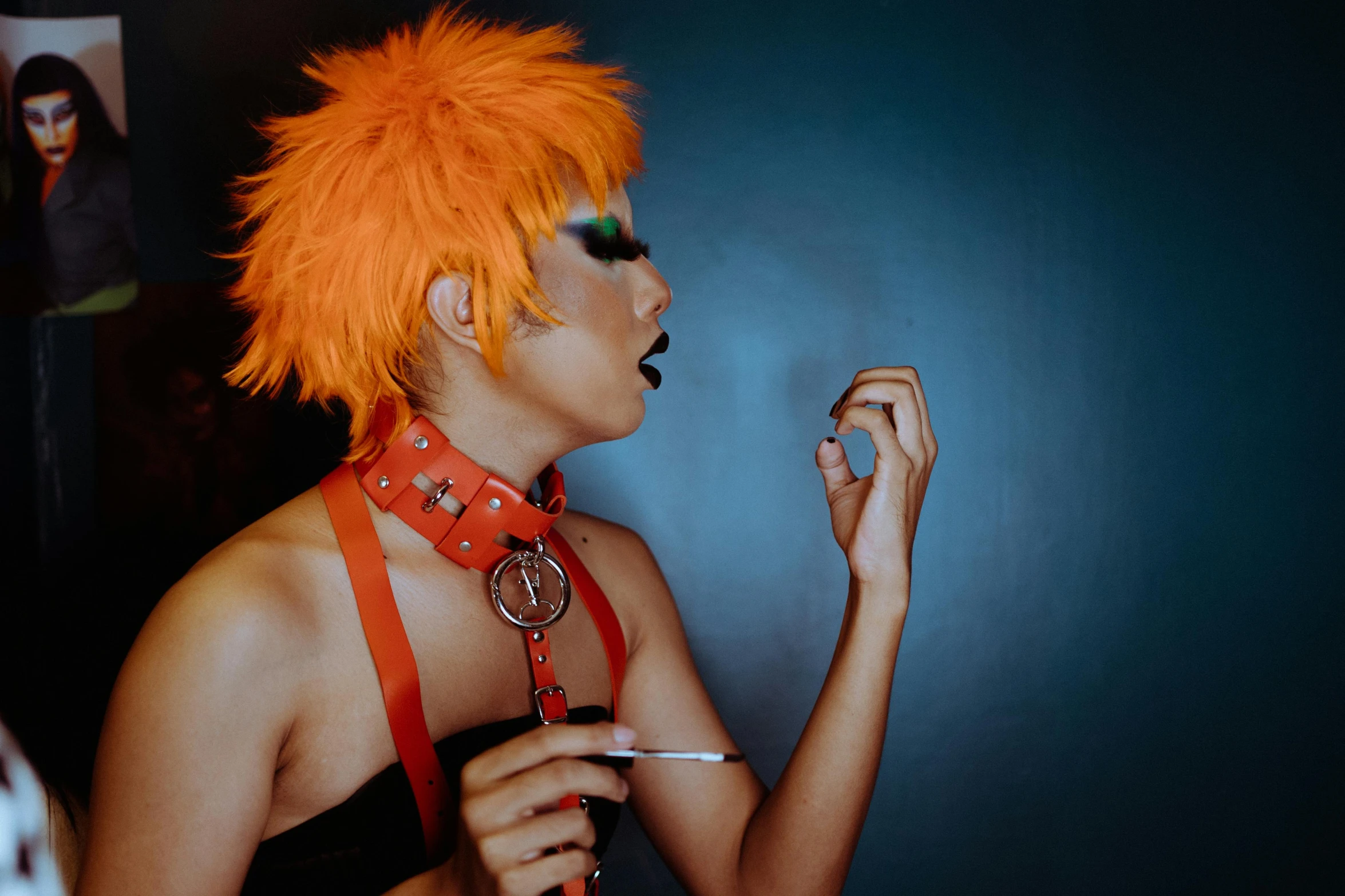 a woman with orange hair smoking a cigarette, an album cover, inspired by James Bolivar Manson, trending on pexels, glamourous cosplay, adonis belt, takeyuki kanda, 33mm photo