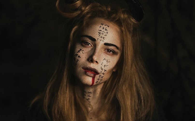 a close up of a person with makeup on, a character portrait, by Emma Andijewska, trending on pexels, renaissance, bloody runes, full body cgsociety, a horned, profile image