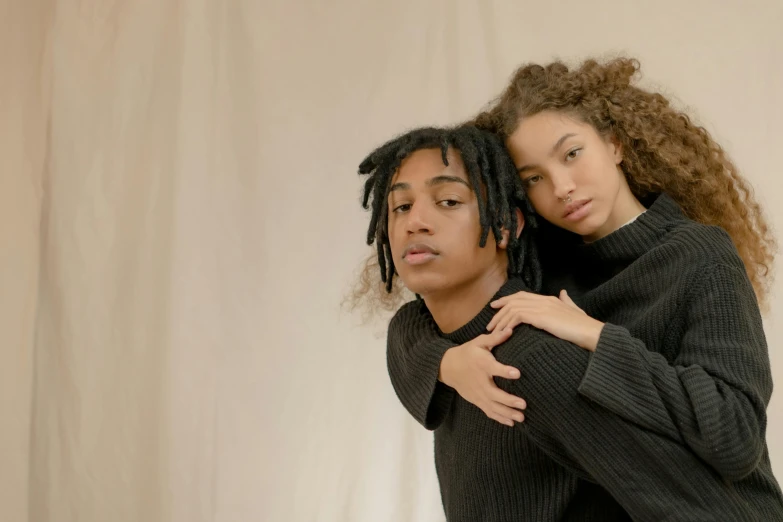 a couple of women standing next to each other, trending on pexels, renaissance, black teenage boy, black turtleneck, lovers, hair