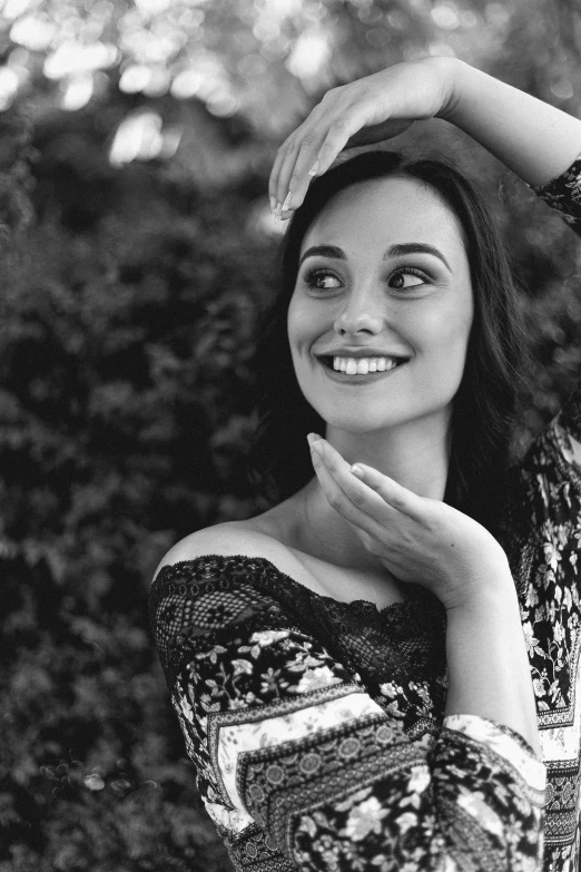 a black and white photo of a woman smiling, arabesque, gorgeous kacey rohl, ukraine. professional photo, 15081959 21121991 01012000 4k, cute young woman