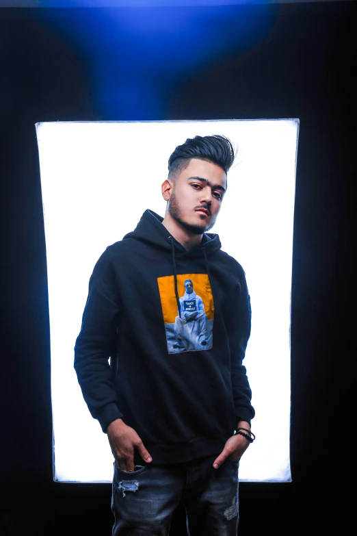 a man in a black hoodie standing in front of a window, inspired by Eddie Mendoza, lyco art, dr zeus, henry ascensio, profile image, dark backdrop