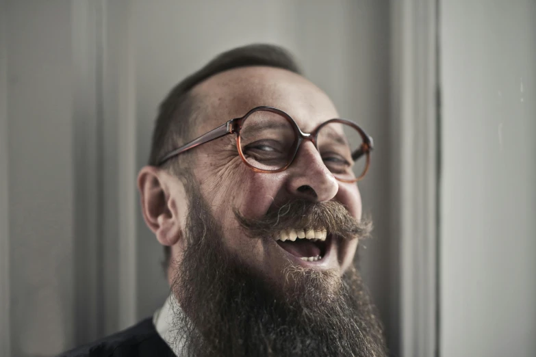 a man with a beard and glasses smiling, inspired by Leo Leuppi, pexels contest winner, giggling, avatar image, alessio albi, marcin rubinkowski