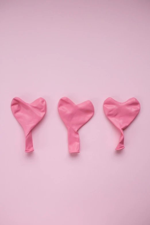 three pink heart shaped balloons on a pink background, pexels contest winner, happening, valves, made of lab tissue, sexuell, hope