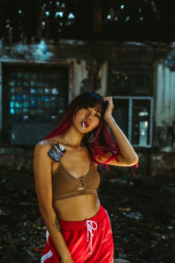 a woman with red hair standing in front of a building, an album cover, inspired by Elsa Bleda, pexels contest winner, graffiti, croptop, beautiful asian woman, smoking body, panoramic view of girl
