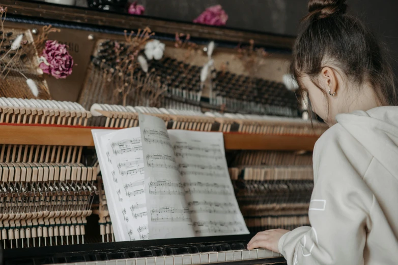 a close up of a person playing a piano, profile image, girl in studio, sheet music, fully functional