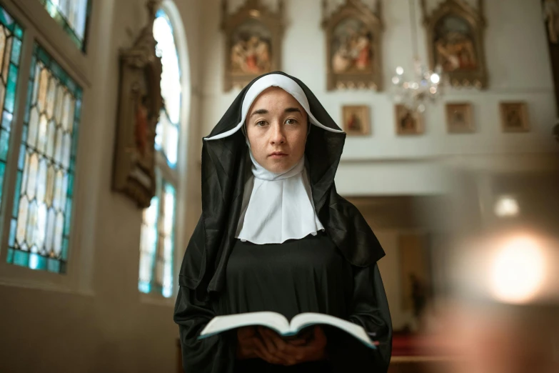 a nun reading a book in a church, a portrait, inspired by Master of the Legend of Saint Lucy, pexels contest winner, cosplay photo, a person standing in front of a, gif, multiple stories