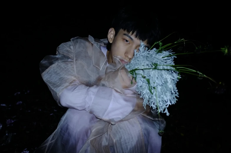 a person in a white dress holding a bunch of flowers, an album cover, inspired by Huang Gongwang, young man, steven klein, soft luminescent glow, wonbin lee