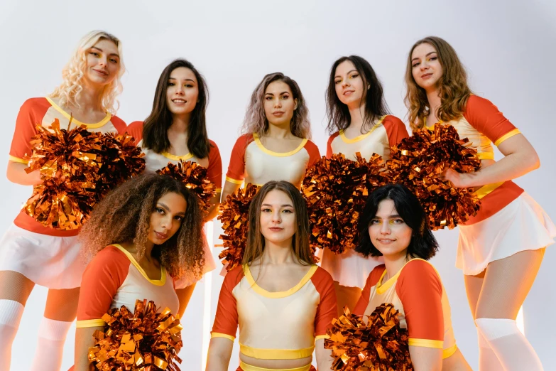 a group of cheerleaders posing for a picture, pexels contest winner, antipodeans, white and orange, avatar image, angelina stroganova, profile image
