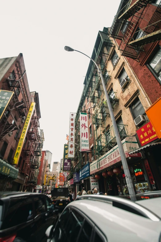 a city street filled with lots of tall buildings, chinatown, new york alleyway, colorful signs, high quality image