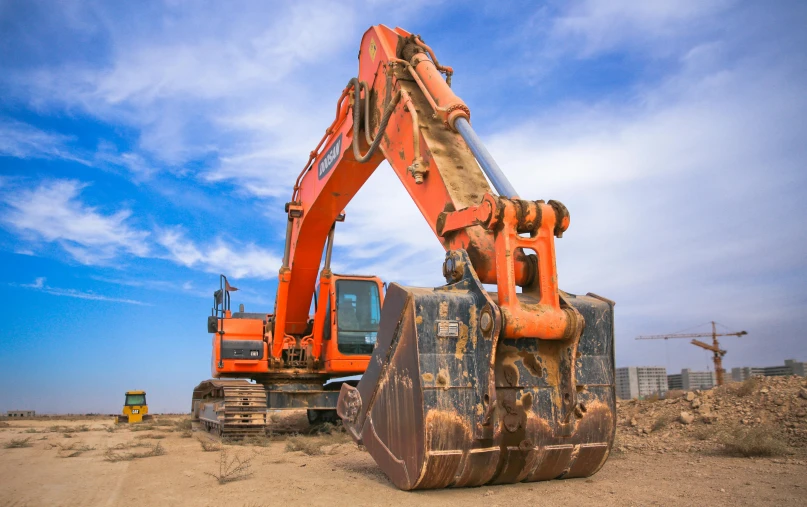 an orange excavator sitting on top of a pile of dirt, pexels contest winner, square jaw, blippi, super high resolution, dredged seabed