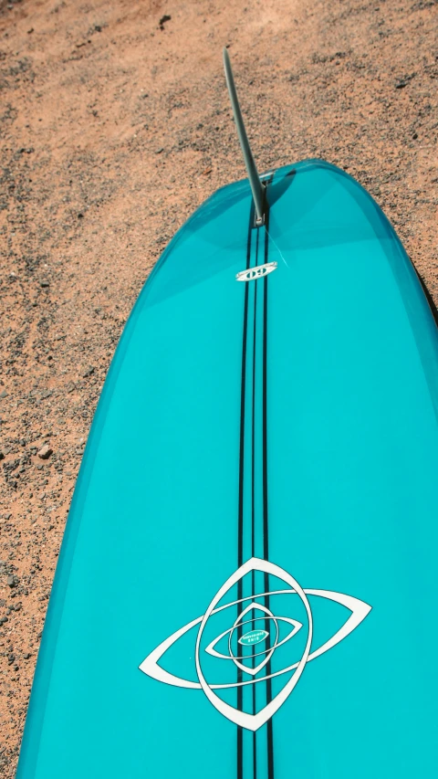 a blue surfboard sitting on top of a sandy beach, up-close, thumbnail, strings, a high angle shot