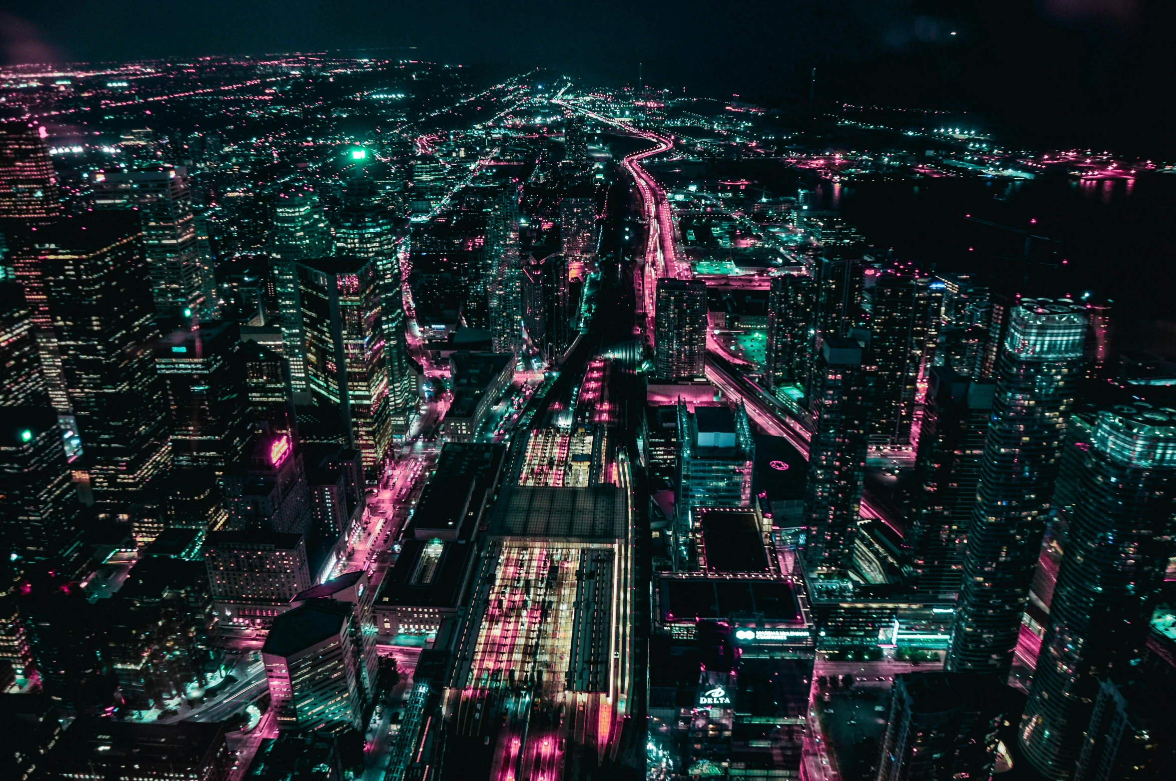 an aerial view of a city at night, by Beeple, unsplash contest winner, pink and teal, hyperdetailed, instagram post, teal electricity