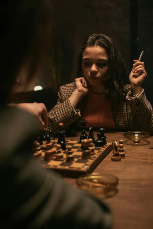 a man and a woman sitting at a table playing chess, a portrait, unsplash contest winner, serial art, from netflix's arcane, she wears a jacket, teenage girl, fighting in a dark scene