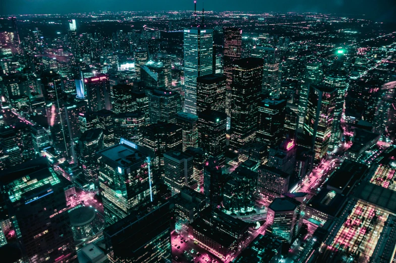 an aerial view of a city at night, by Beeple, unsplash contest winner, toronto city, turquoise and pink lighting, instagram post, computer wallpaper