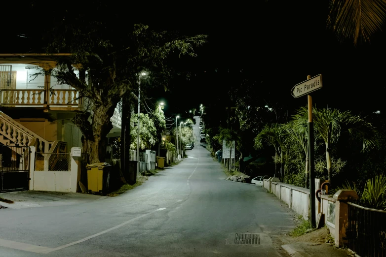 an empty street is lit up at night, unsplash, hyperrealism, sri lanka, helio oiticica, in an american suburb, an eerie