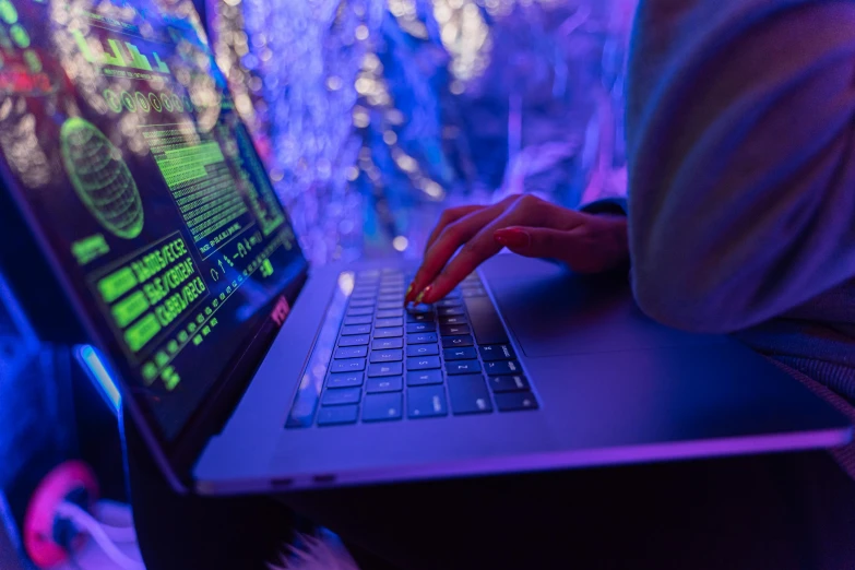 a close up of a person typing on a laptop, pexels, computer art, blue lights and purple lights, hacking into the mainframe, cyberpunc, instagram post