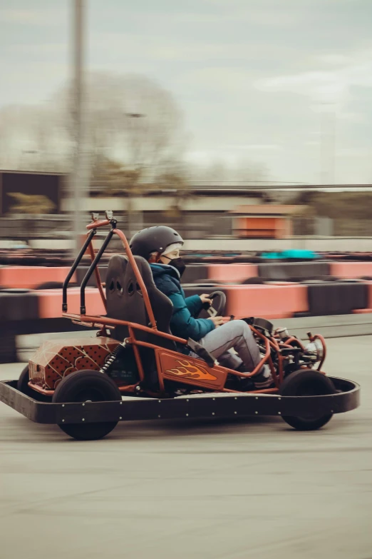 a person driving a go - kart on a track, by Cornelisz Hendriksz Vroom, charging through city, tjalf sparnaay 8 k, octane tender, wooden