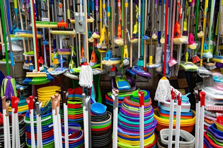 a room filled with lots of different colored objects, whips, commercial photo, sweeping, market