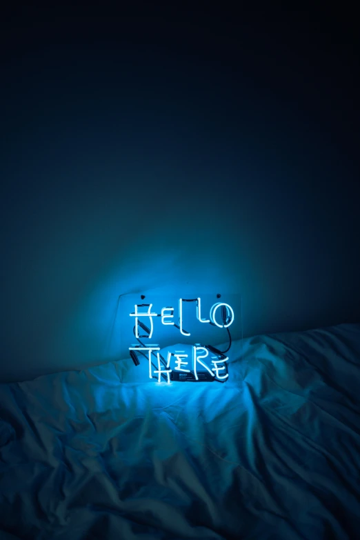 a blue neon sign sitting on top of a bed, inspired by Elsa Bleda, unsplash contest winner, happening, hello, i'm here, selfie photo, album cover