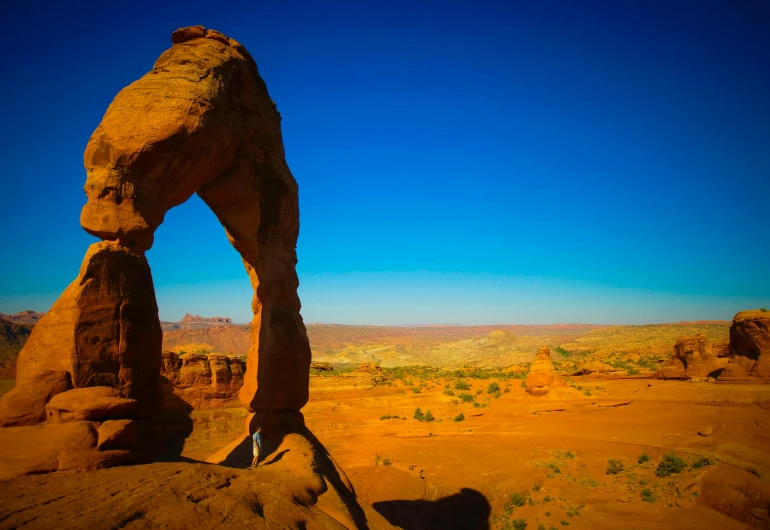 a large rock formation in the middle of a desert, a statue, by Julia Pishtar, pexels contest winner, arched back, moab, a brightly colored, post-processed