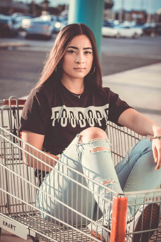 a woman sitting in a shopping cart in a parking lot, pexels contest winner, lowbrow, graphic tees, good looking face, food focus, 5 0 0 px models