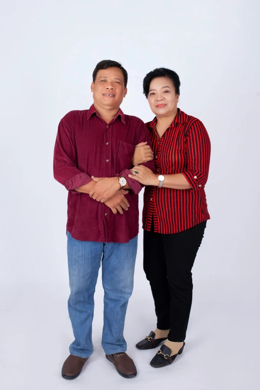 a man and a woman standing next to each other, by Basuki Abdullah, in a photo studio, 2 5 6 x 2 5 6 pixels, 15081959 21121991 01012000 4k, casual clothing