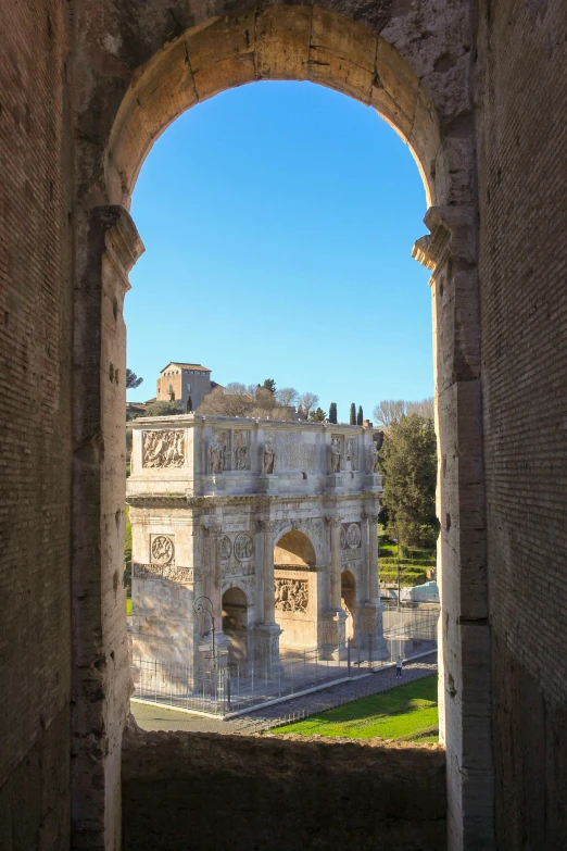 a view of a building through an arch, inspired by Romano Vio, neoclassicism, seen from above, blue sky, torri gate, seen from a distance