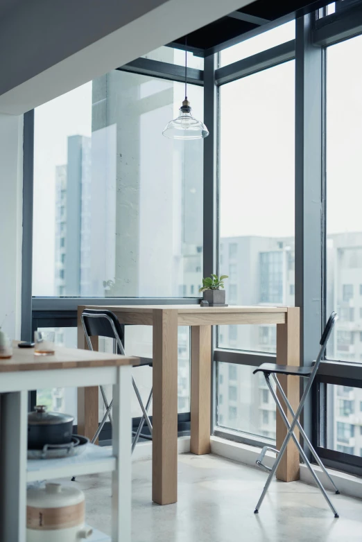 a kitchen with a table and chairs in front of a large window, by Daarken, unsplash, light and space, set in tokyo rooftop, closeup - view, profile image, office furniture