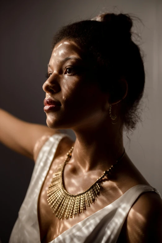 a woman in a white dress holding a wine glass, inspired by Gordon Parks, brown skin. light makeup, intricate led jewellery, well lit studio lighting, wears a egyptian ankh necklace