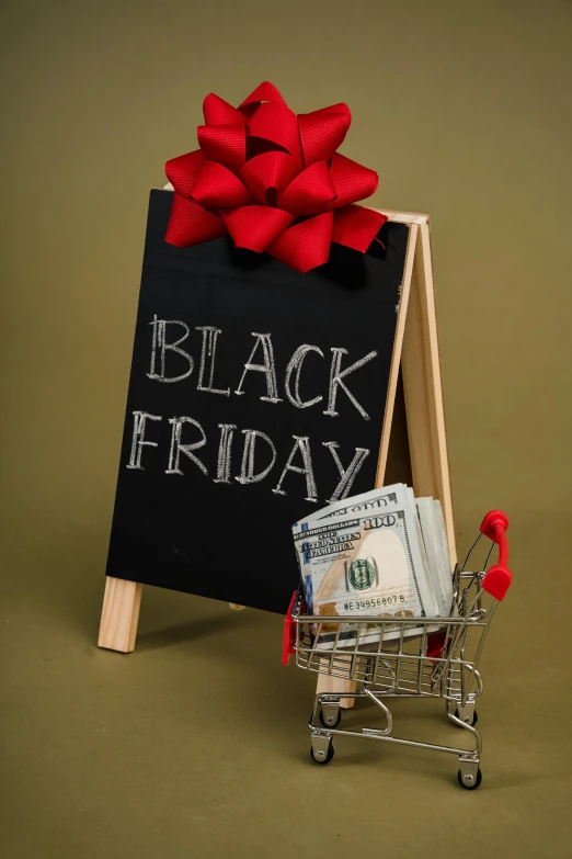 a shopping cart filled with money next to a black friday sign, by Robert Richenburg, blackboard, thumbnail, seasonal, premium