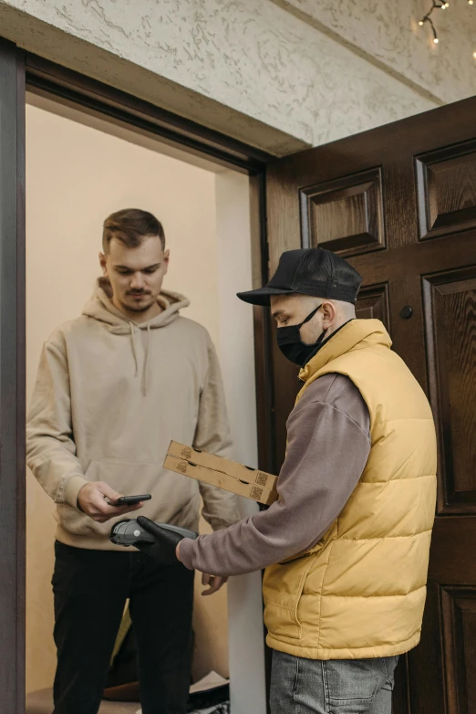 a couple of men standing next to each other in front of a door, delivering parsel box, facemask, kacper niepokolczycki, thumbnail