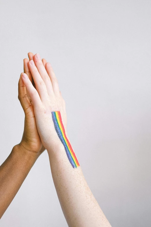 two people giving each other a high five, by Gavin Hamilton, synchromism, rainbow accents, bandage on arms, profile image, tattoo