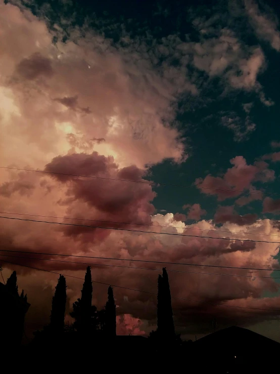 a cloudy sky with power lines in the foreground, by Alexis Grimou, aestheticism, ☁🌪🌙👩🏾, pink tinged heavenly clouds, album, late summer evening