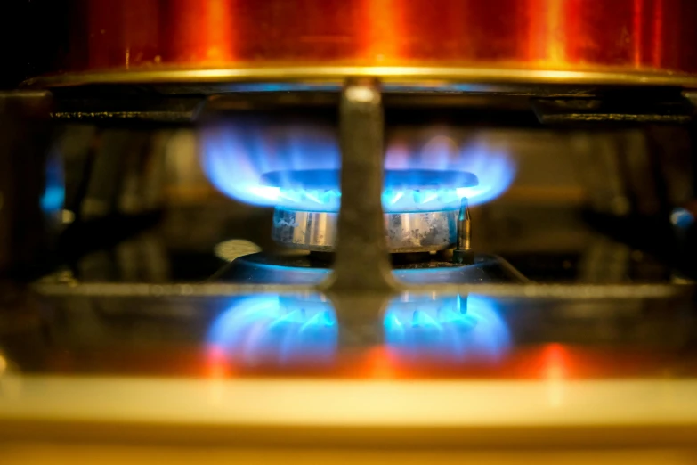 a close up of a gas burner on a stove, by Matt Cavotta, shutterstock, blue print, instagram picture, 2995599206, petrol energy