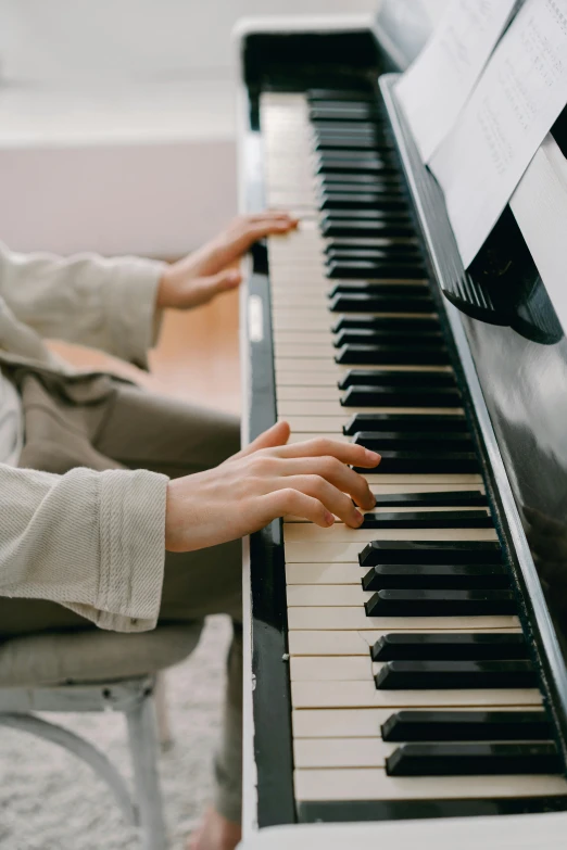 a close up of a person playing a piano