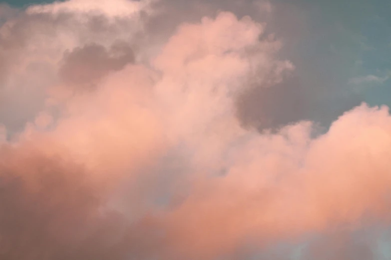 a large jetliner flying through a cloudy sky, an album cover, inspired by Elsa Bleda, unsplash, romanticism, pink pastel, cotton candy clouds, in shades of peach, a close-up